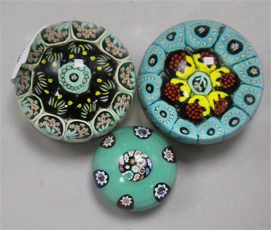 A Paul Ysart millefiori glass paperweight and two other weights possibly by Paul Ysart